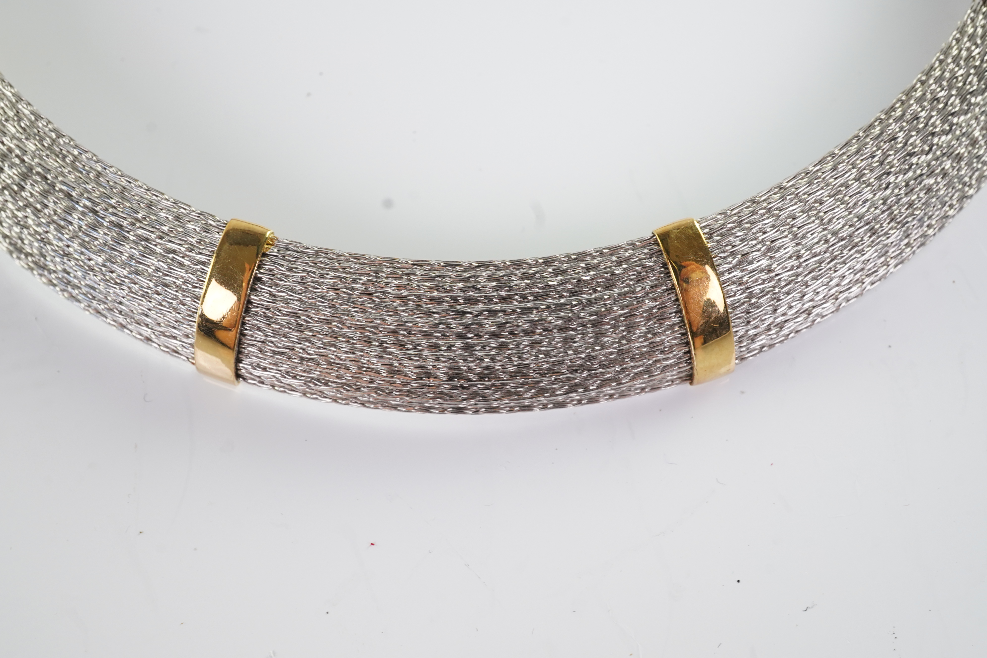 An 18ct gold collar and bangle